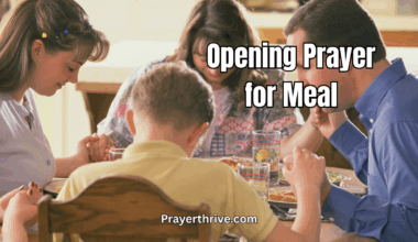 A family bowing their heads in gratitude before eating, sharing an intimate moment of faith during an opening prayer for meal.