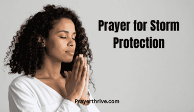 A woman stands near a window, hands clasped in prayer for storm protection as rain pours and lightning flashes outside — a peaceful reminder of faith through the storm.